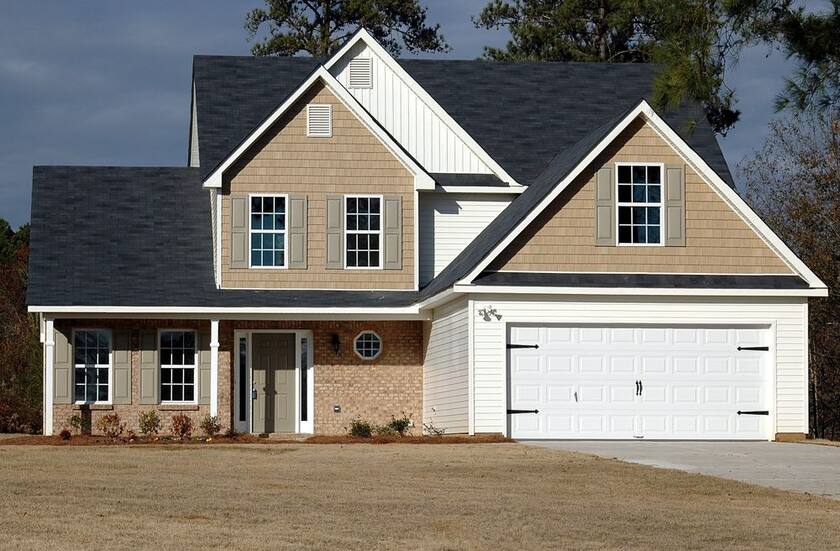 Two-story home with a new dark architectural shingle roof