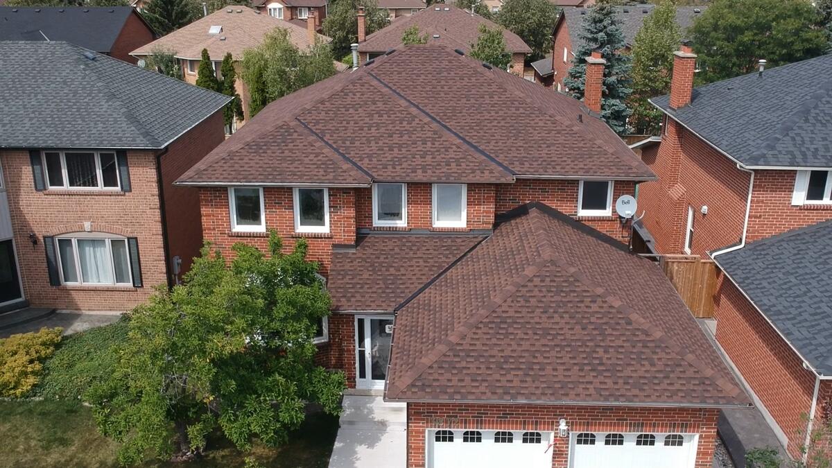 Drone view of a finished architectural shingle roof by Tulsa Quality Roofing